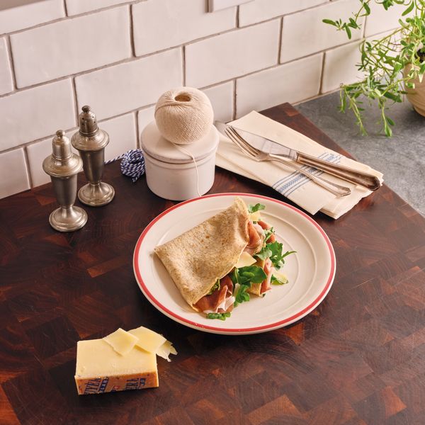 Crepe with ham and lettuce on plate